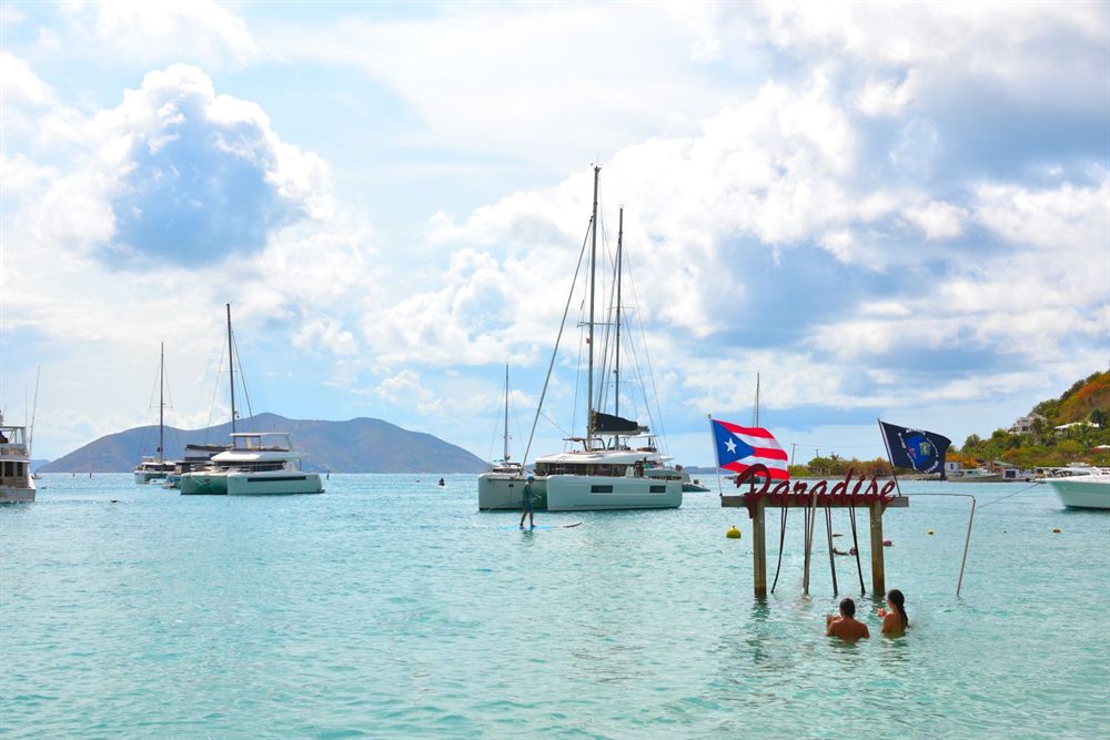 Charter catamarans at anchor in shallow clear water, Tortola, British Virgin Islands